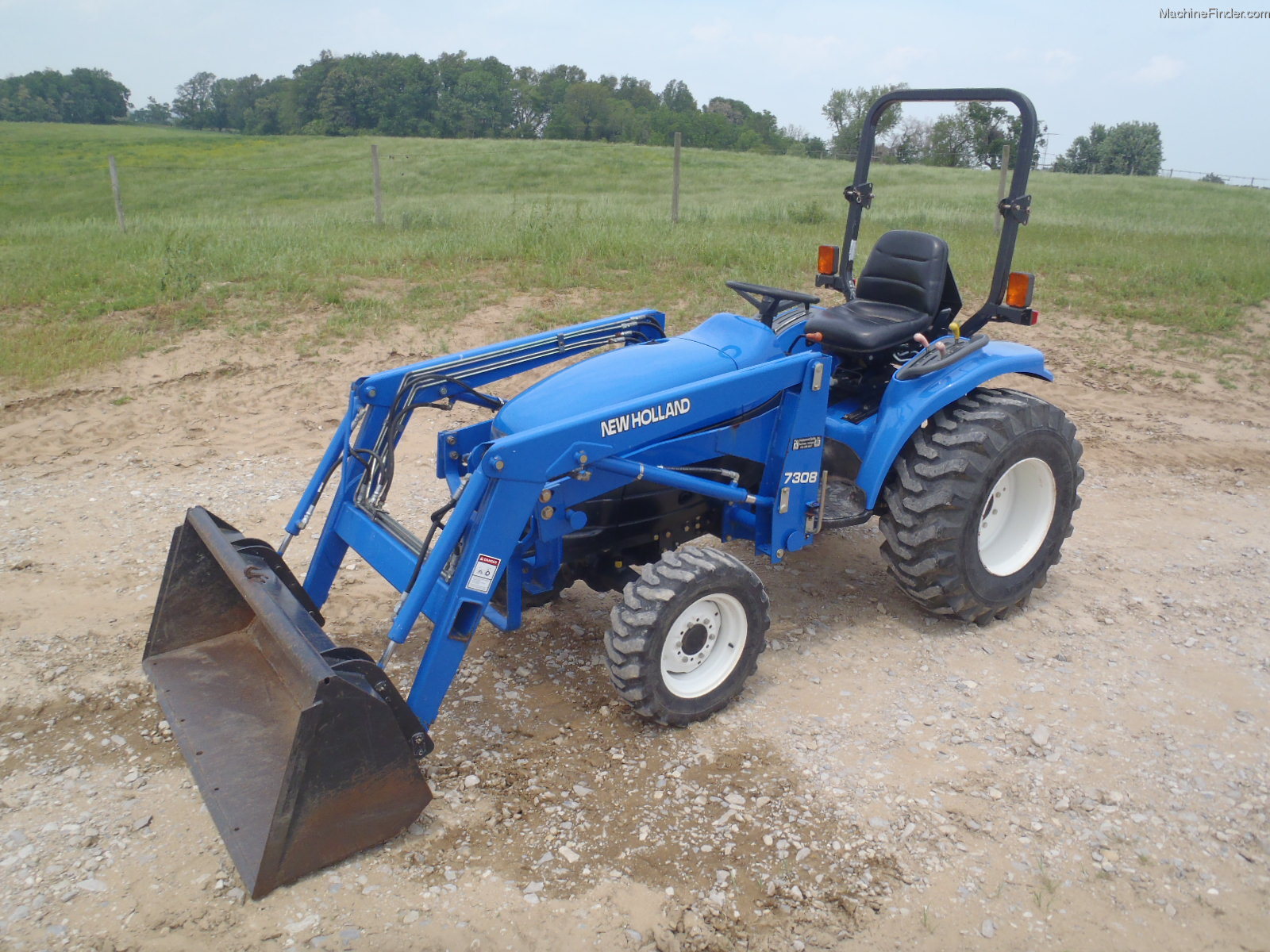 1998 New Holland TC33 Tractors Compact (140hp.) John Deere