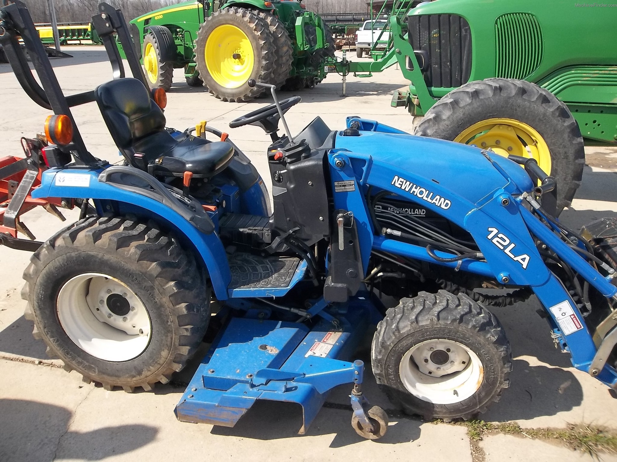 2003 New Holland TC24 Tractors Compact (140hp.) John Deere